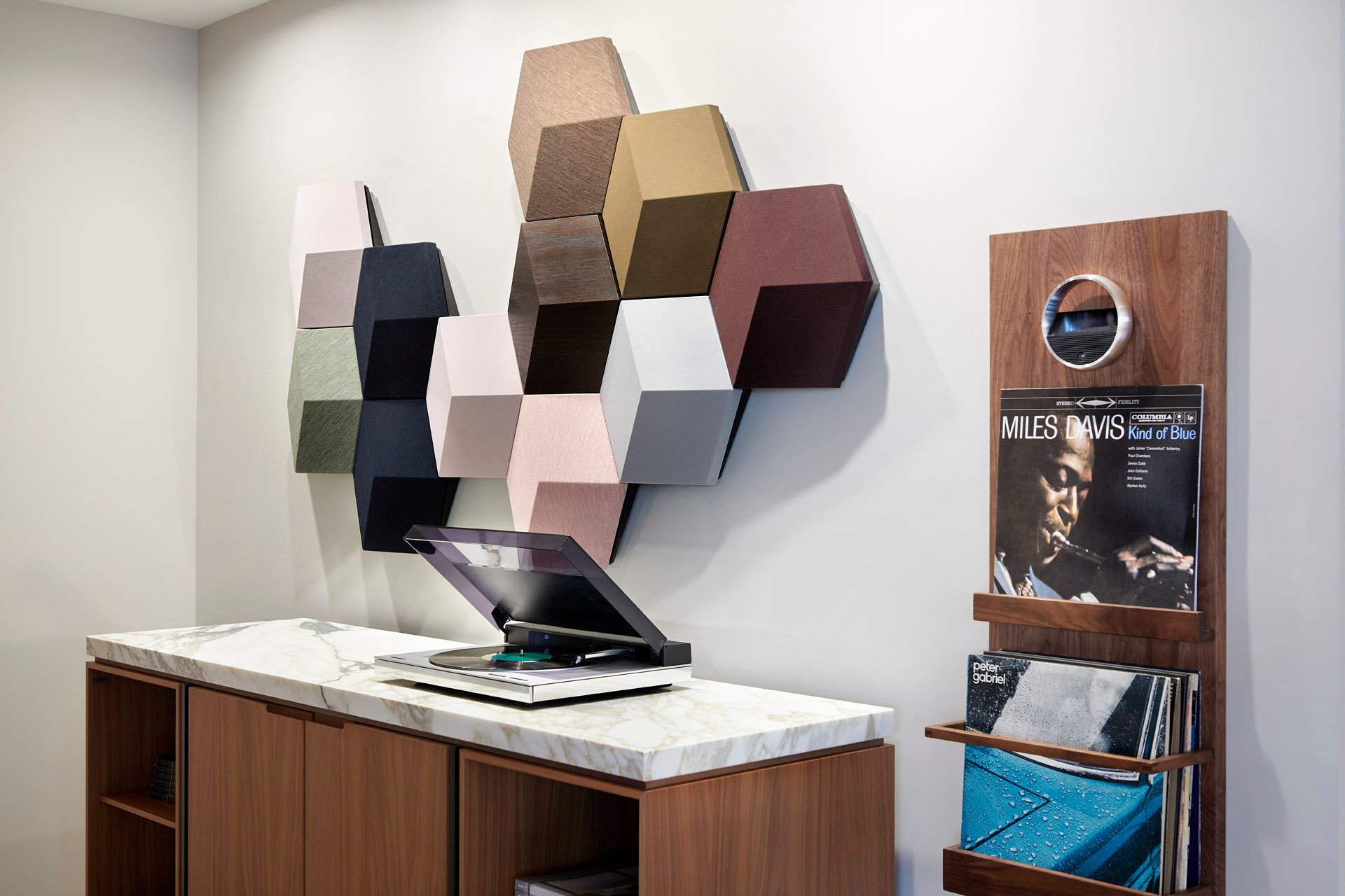 SoWa showroom: colourful wall-mounted speakers above a turntable and record collection