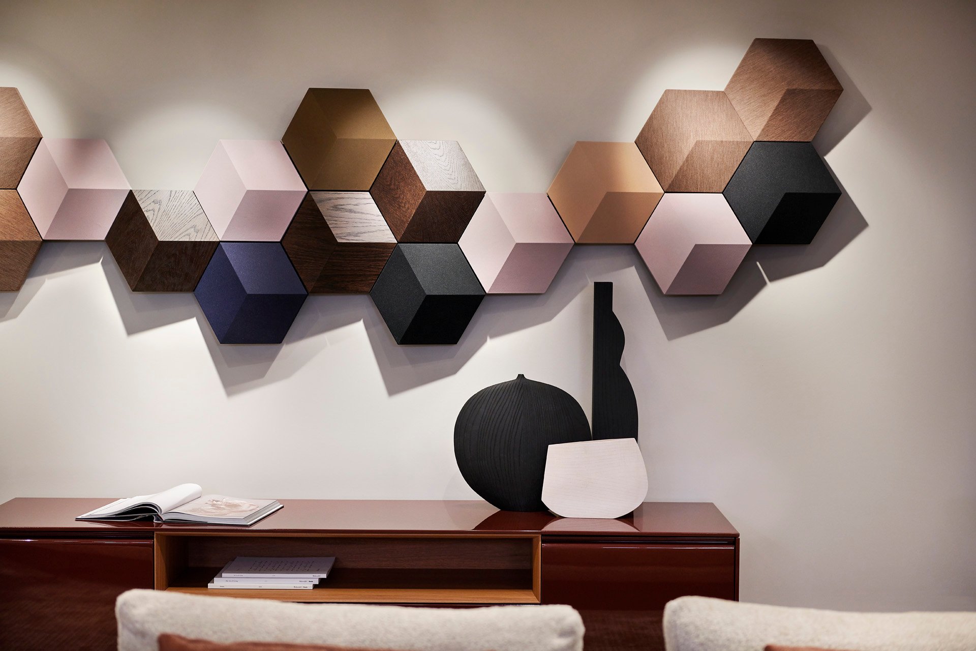 SoWa showroom: colourful hexagonal wall speakers above a wood sideboard